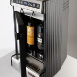 Wineemotion Mia is a refrigerated wine dispenser. It preserves wine by filling the bottle with food grade argon gas. It uses a special tap that pours a precise amount of wine while keeping oxygen away from the wine. Mia features a noiseless fridge, making it ideal for home use. mia wine by the glass dispenser for home